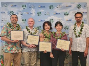 5 University of Hawaii Excellence in Extension Programming Team Award winners accepting their award.